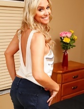 Long-haired blonde in sexy jeans