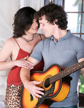 Romantic curly-haired guy fucks mature after playing guitar