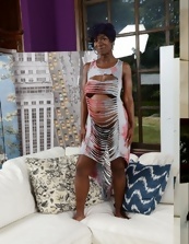 Pregnant female with dark skin poses for ATK hairy gallery