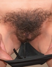 Sexy mom brunette demonstrates small tits and hirsute vagina