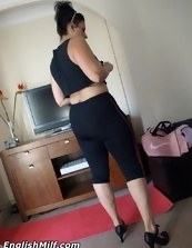 Black-haired housewife during yoga shows her sexy milf ass