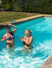 Mature friends spend a good time showing big tits in the pool