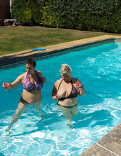 Mature friends spend a good time showing big tits in the pool