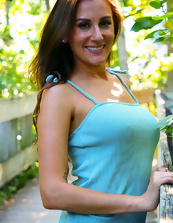 Cheerful woman in blue dress flashes pussy in public place
