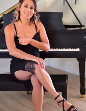 Beautiful Latina mom finds time to ride stick-on dildo near piano