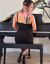 Beautiful Latina mom finds time to ride stick-on dildo near piano