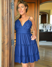 Hot pics of busty MILF taking off blue dress in the corridor