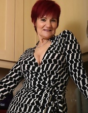 Solo pics of short-haired mature undressing in the kitchen