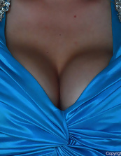 Pics of blond MILF with big tits taking off blue dress