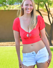 Outdoor pics of joyful blonde mom showing her assets