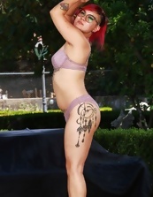 Alt redhead displays her bush in outdoor MILF porn pics
