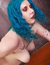 Blue-haired mom shows her hairy cunny in solo pics