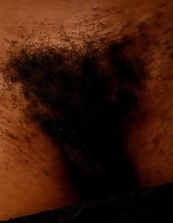 Black mom shows her sexy bush in solo MILF porn pics