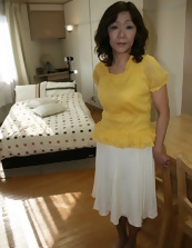 A mature woman from Asia looking seductive and horny
