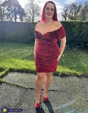 One mature nude redhead wearing the sluttiest dress