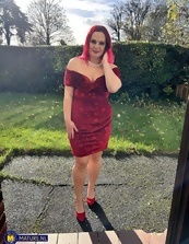 One mature nude redhead wearing the sluttiest dress