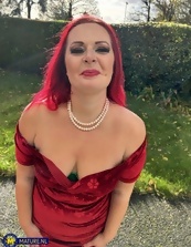 One mature nude redhead wearing the sluttiest dress