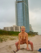 Nude women photos with a buzzcut babe teasing outside