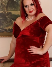 Redheaded older lady in red dress shows her sagging tits