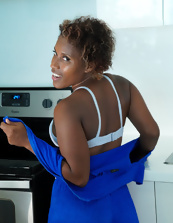 Ebony mom slowly unzips her outfit to play with her breasts
