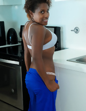 Ebony mom slowly unzips her outfit to play with her breasts