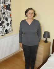 Mature Woman Striptease In Bedroom