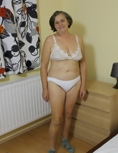 Mature Woman Striptease In Bedroom