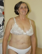 Mature Woman Striptease In Bedroom