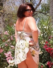 Busty Mature Nude In Garden Photos