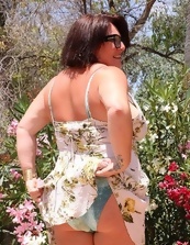 Busty Mature Nude In Garden Photos