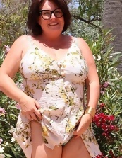 Busty Mature Nude In Garden Photos