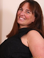 Mature with big smile and huge tits posing nude