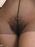 Redhead babe showing off her thick hairy bush up close