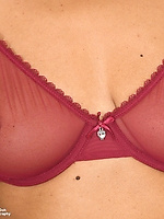 Slim mature babe teases in red sheer and spreads her juicy pussy