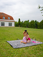 Outdoor nude trio on blanket in spread pose with fingering pussy in raw lesbian action