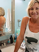 Milf flashes boobs and spreads on kitchen stool
