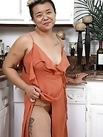 Free Asian mature pics show short-haired wife in kitchen
