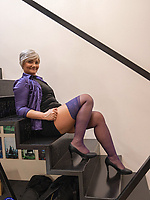 Mature woman in purple stockings teases on stairs with young babe in panties