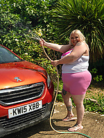 Mature babe washes car in pink shorts and teases curvy big booty in tight mini skirt