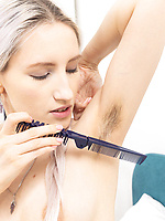 Solo tease with naked blonde showing hairy bush and armpits