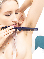 Solo tease with naked blonde showing hairy bush and armpits