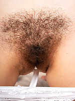 Naked babe with bushy pussy and hairy armpits in spread solo tease
