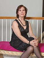 Mature milf strips down from black dress to lace lingerie and finally nude, showing saggy tits