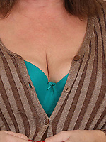 Mature nude babe strips leopard skirt to teal bra then bares saggy tits and curvy booty