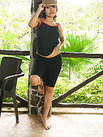 Babe outdoor solo tease with spread pose showing natural tits and bushy pussy
