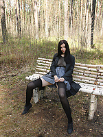 Nude outdoor forest solo tease showing bare booty on wooden bench
