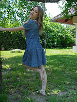 Clothed babe outdoor solo tease with dress lifted for bare ass out
